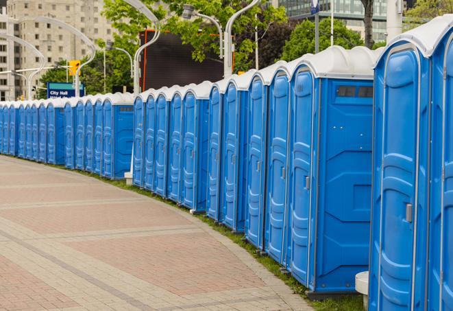 a row of portable restrooms at a fairground, offering visitors a clean and hassle-free experience in hancock